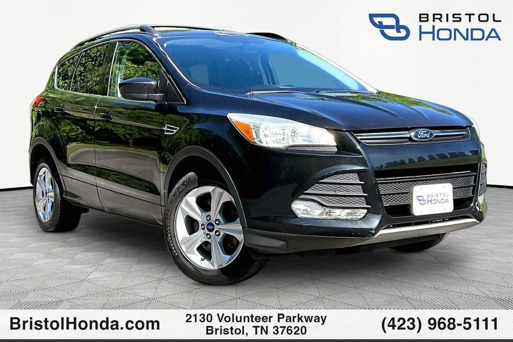 2013 Ford Escape SE in Tuxedo Black — front three-quarter view